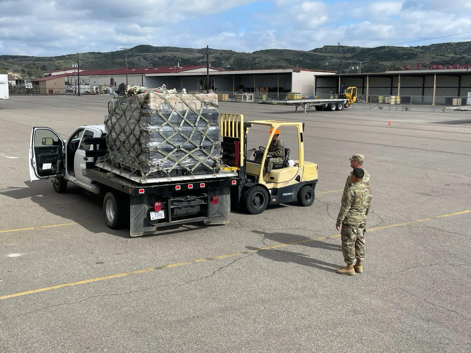 Airmen working at computer workstations during the Project Convergence command-and-control experiment.