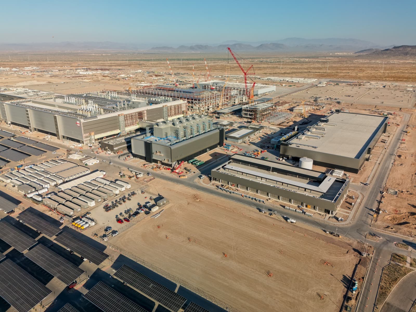 Construction cranes over the TSMC semiconductor fab site in Phoenix, Arizona