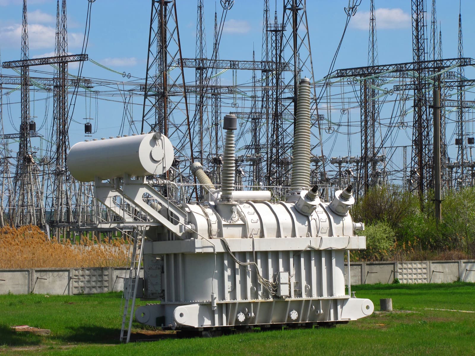 A high-voltage 750 kV transformer at an electrical substation