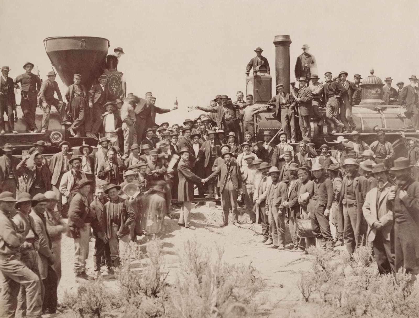 Crews celebrate the completion of the transcontinental railroad at Promontory Summit, Utah, 1869